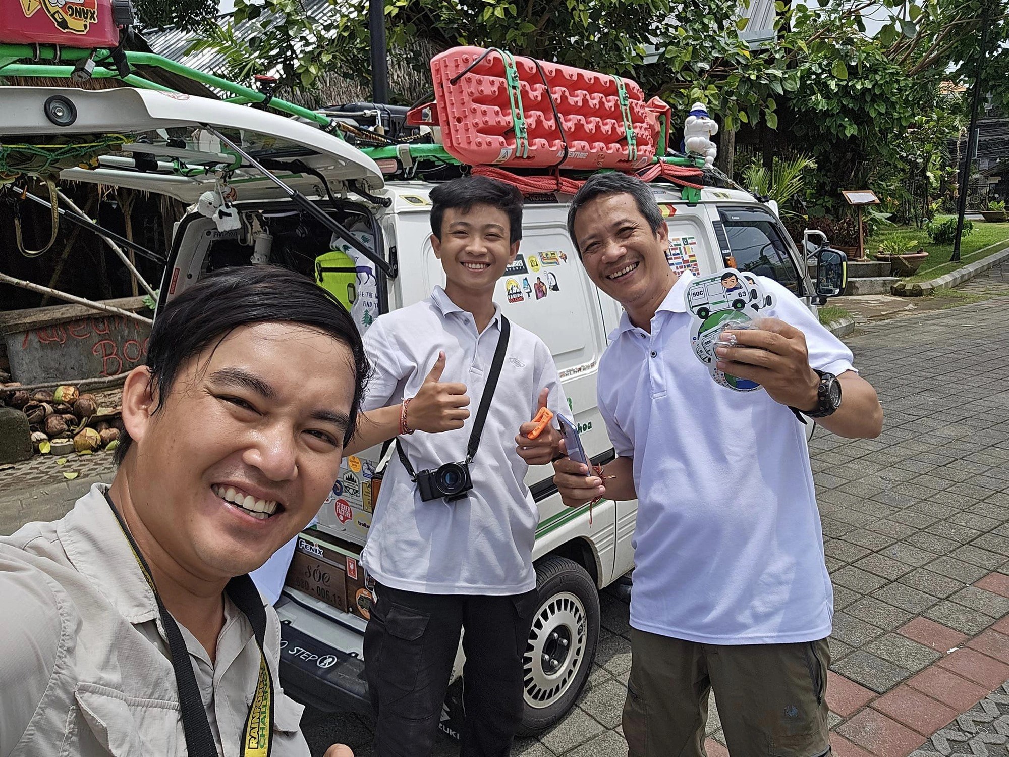 Tran Dang Dang Khoa takes a selfie with an Indonesian man and his son. The local man hopes his son will be inspired by Khoa's journey as a photographer traveling the globe. Photo provided by Dang Khoa