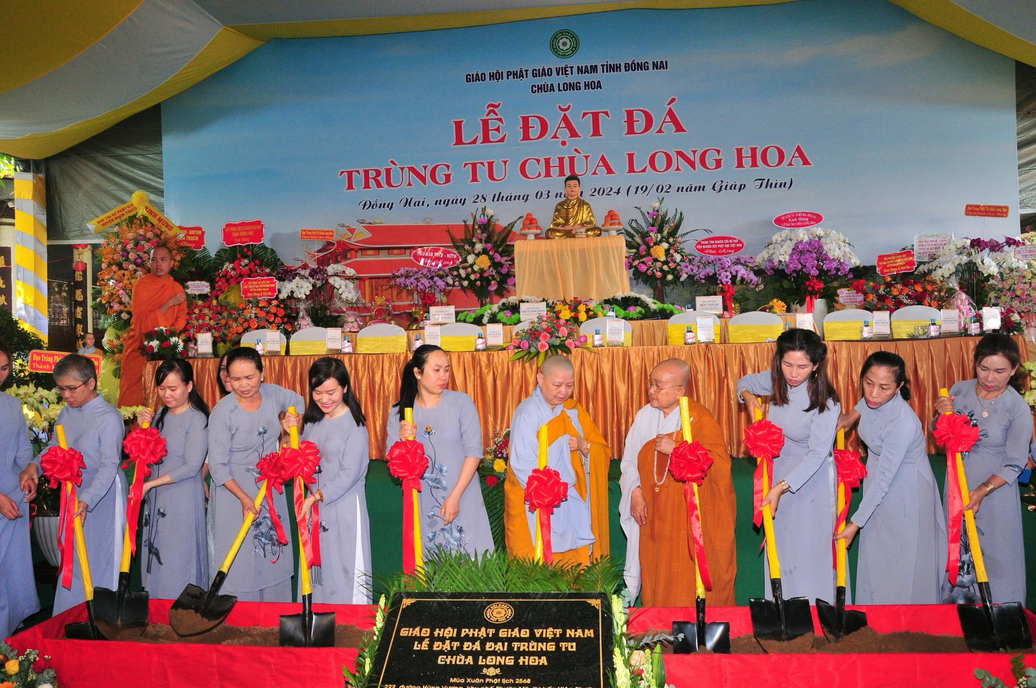 Buddhist nuns and Buddists make a symbolic gesture to lay a foundation stone for the restoration of Long Hoa Pagoda in Dong Nai Province, southern Vietnam. Photo: Supplied
