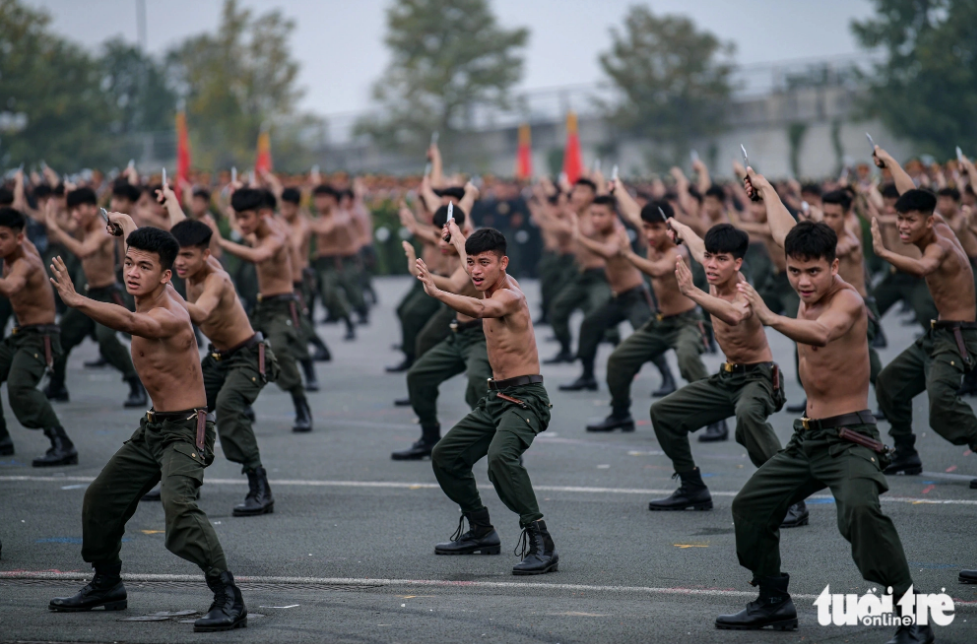 Military officers perform their martial arts skills during a rehearsal for a parade on March 31, 2024. Photo: Tuoi Tre