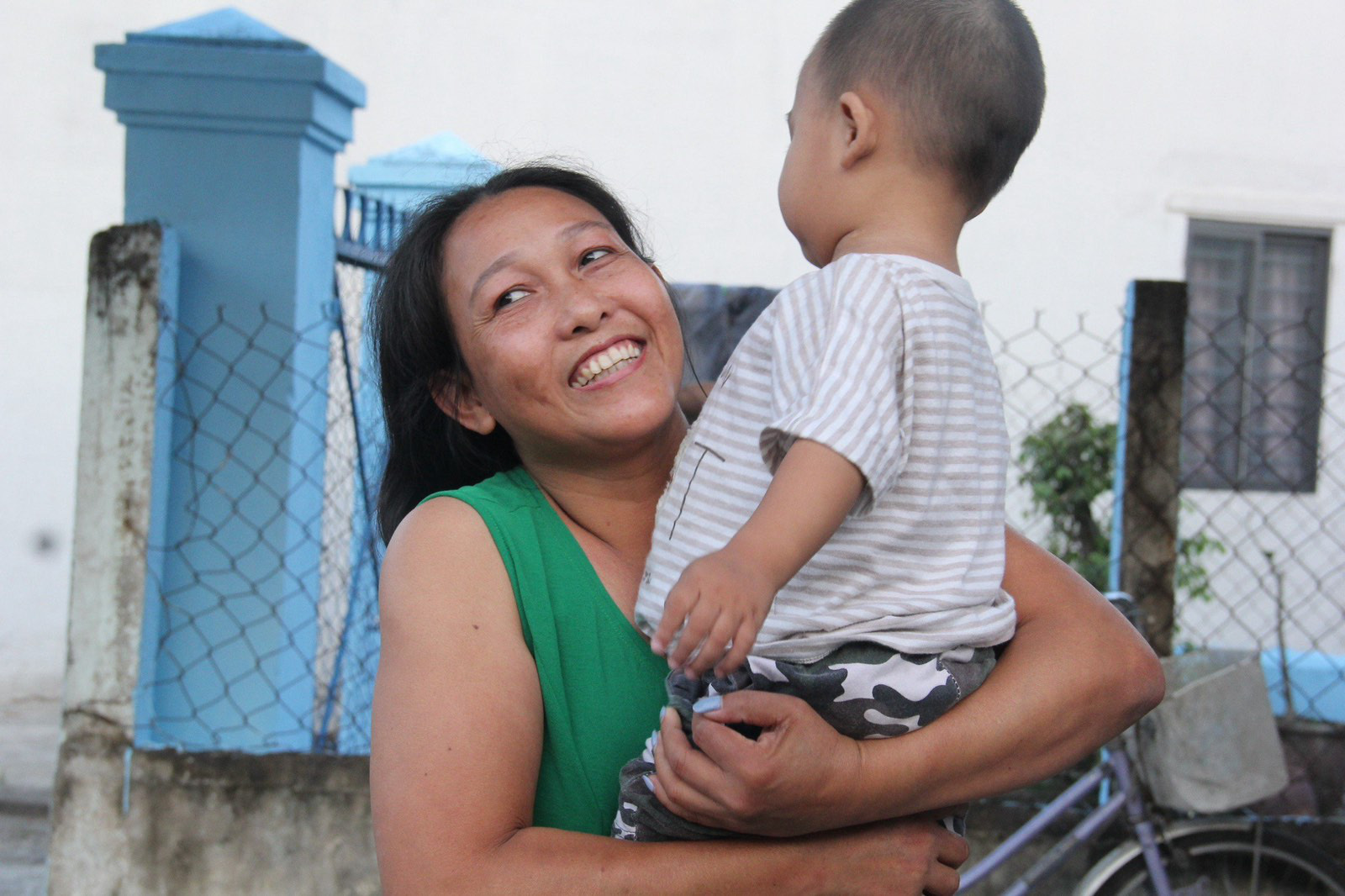Nguyen Thi Ngoc Hang holds her three-year-old son Nguyen Anh Loc in their hometown in Quang Ngai Province, central Vietnam. Photo: Tran Mai / Tuoi Tre
