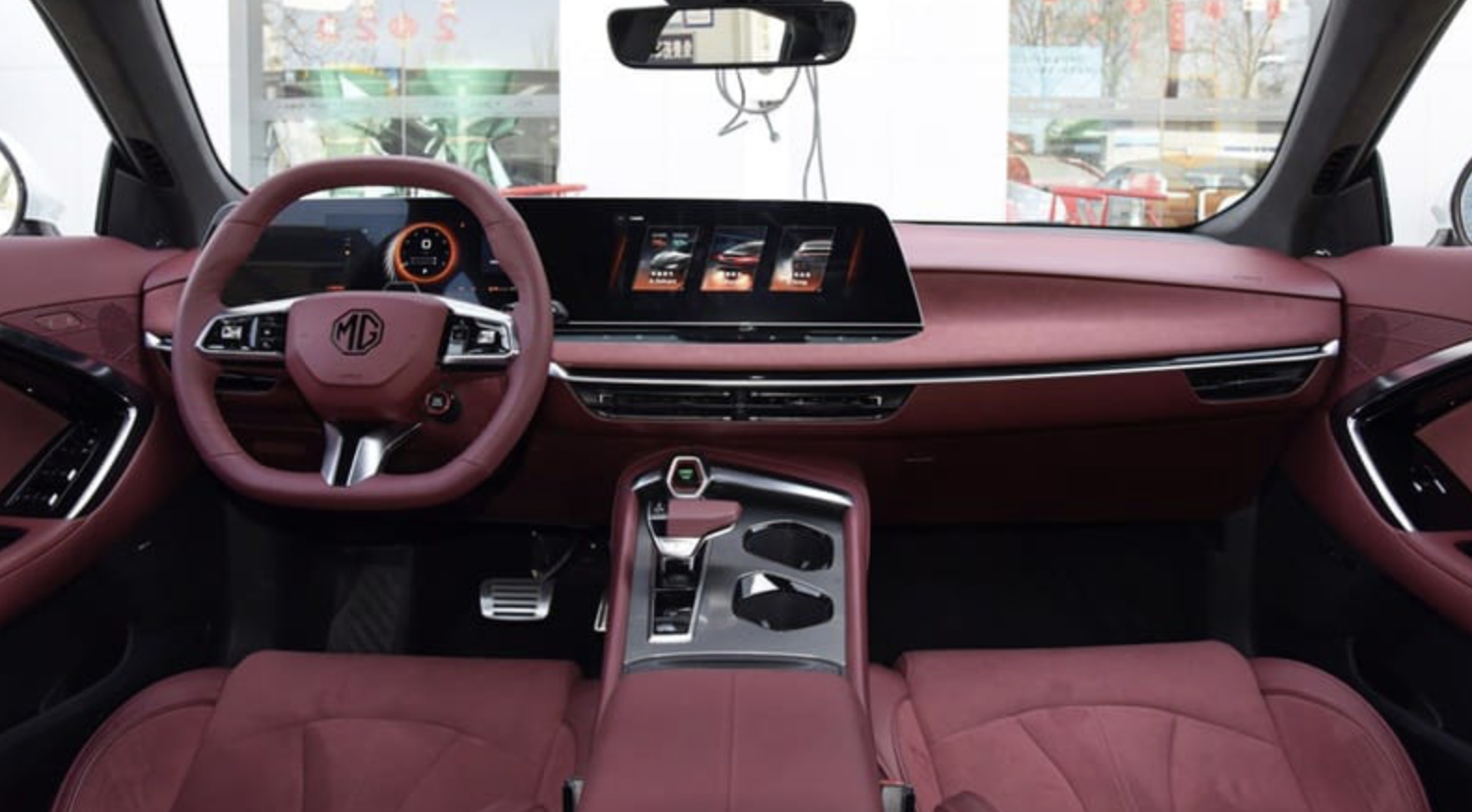 Its modern interior is equipped with two large screens, sporty seats, and an electronic gear selector. Photo: MG