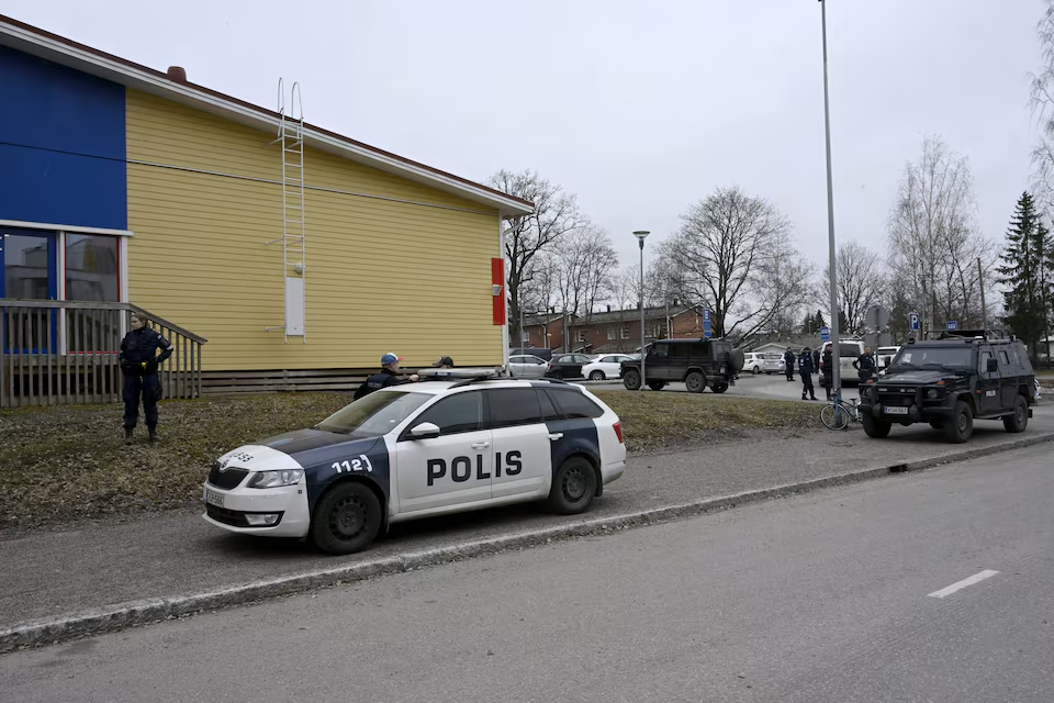 Police officers and police vehicles operate at the Viertola comprehensive school in Vantaa, Finland, on April 2, 2024. Three minors were injured in a shooting at the school on Tuesday morning. A suspect, also a minor, has been apprehended. Lehtikuva/Markku Ulander via Reuters