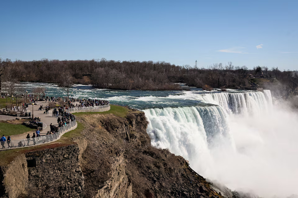 Tourists look at the American Falls, ahead of the Solar Eclipse that will take place across parts of the United States and Canada on April 8, at Niagara Falls, New York, U.S., April 7, 2024. Photo: Reuters