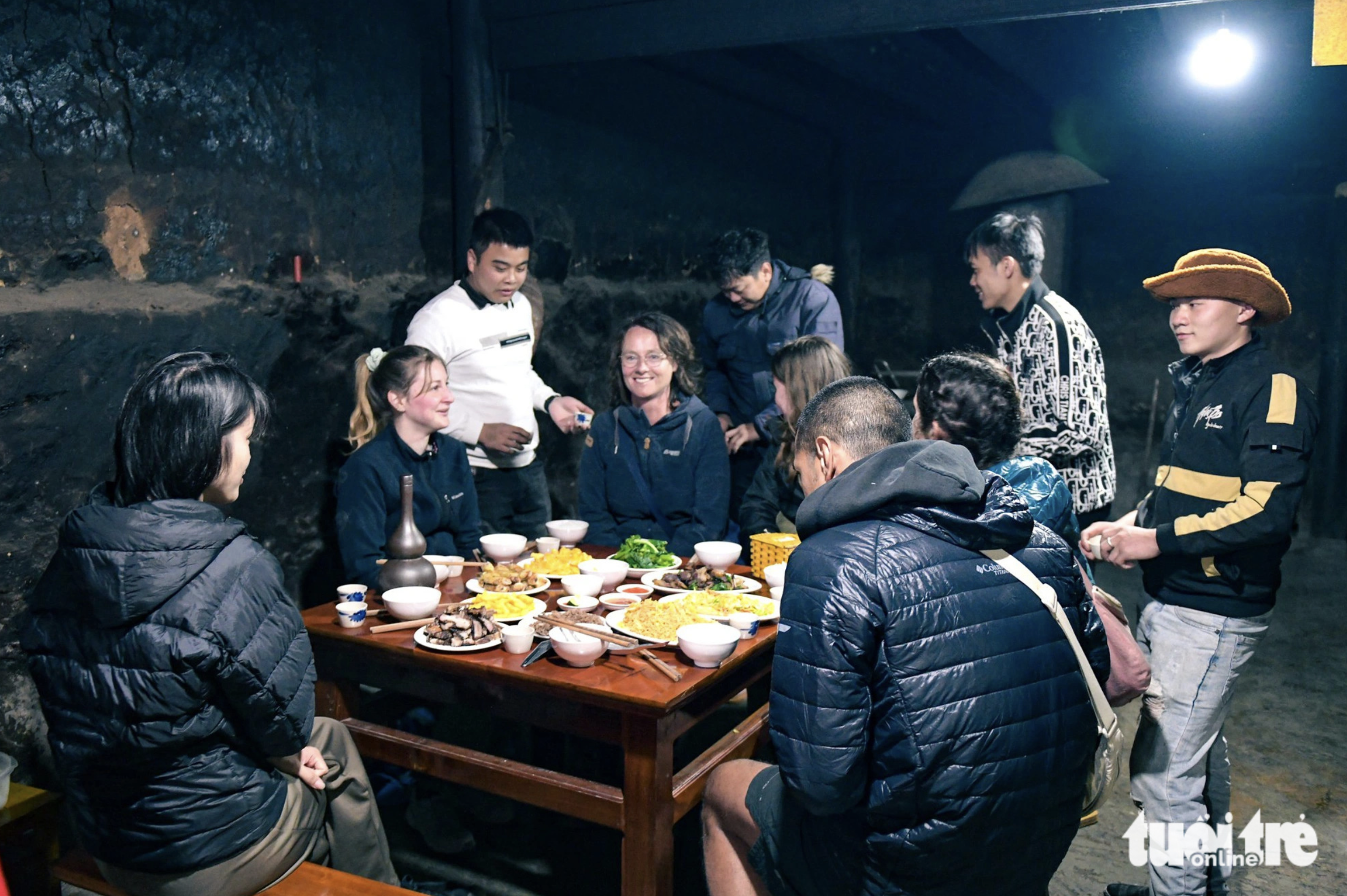 A dinner of various local dishes treated to foreigners in Lao Xa Village in Ha Giang Province, northern Vietnam. Photo: Nam Tran / Tuoi Tre