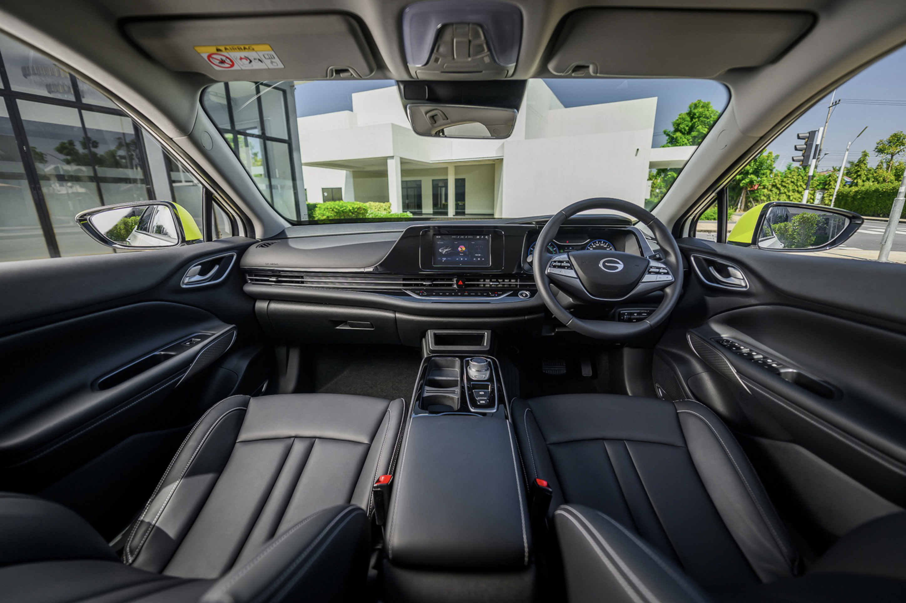 The Aion ES features a small touch screen, an automated parking brake and automatic air conditioning. Photo: AION