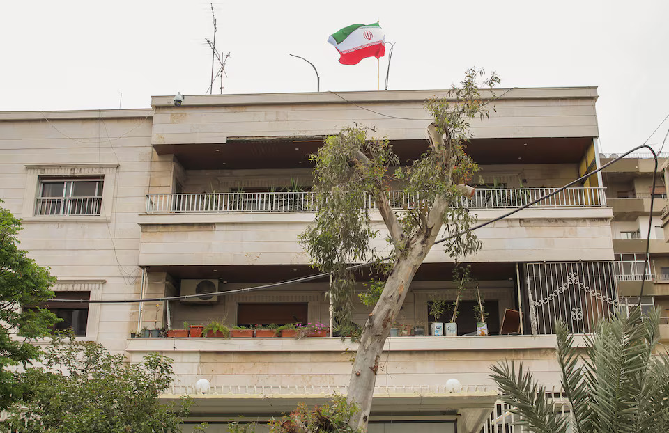 Iranian flag flutters on new Iranian consulate building after Iran's consulate in Damascus was targeted in a suspected Israeli attack on Monday April 1, in Damascus, Syria April 8, 2024. Photo: Reuters