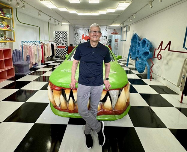 Tim Cook poses for a photo with a car tuned by Vietnamese director Phuong Vu on April 15, 2024. Photo: Supplied