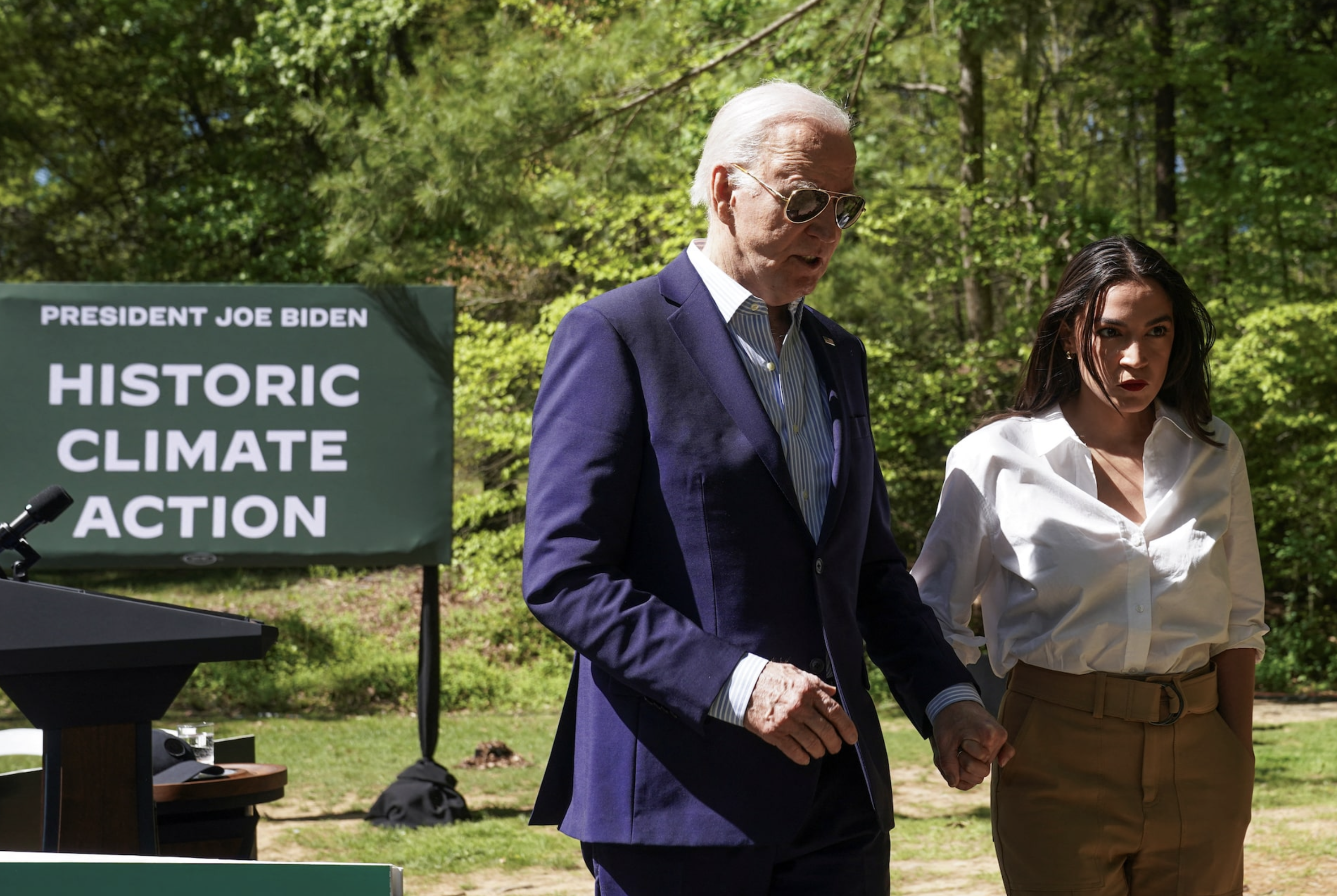 U.S. President Joe Biden and U.S. Representative Alexandria Ocasio-Cortez (D-NY) walk together at an event to commemorate Earth Day during a visit to Prince William Forest Park in Triangle, Virginia, U.S., April 22, 2024. Photo: Reuters