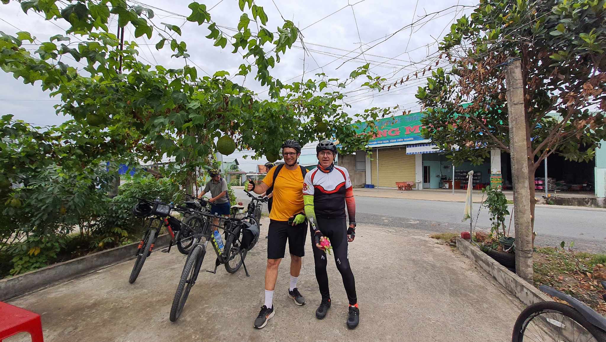 Ray Kuschert (right), hailing from Australia, enjoys a cycling excursion with friends in My Tho, Tien Giang Province, Mekong Delta, Vietnam. Photo: Ray Kuschert