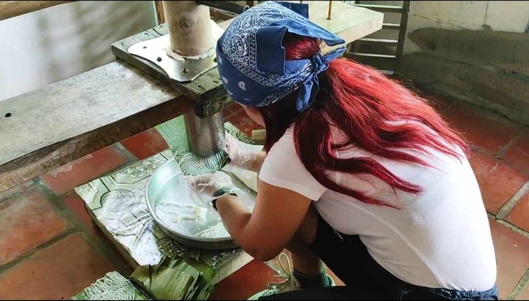 Sally Bell, a tourist from Malta, tries making ‘bánh tráng’ (Vietnamese rice paper) during her visit to Can Tho City in the Mekong Delta, Vietnam in February 2023. Photo: Sally Bell