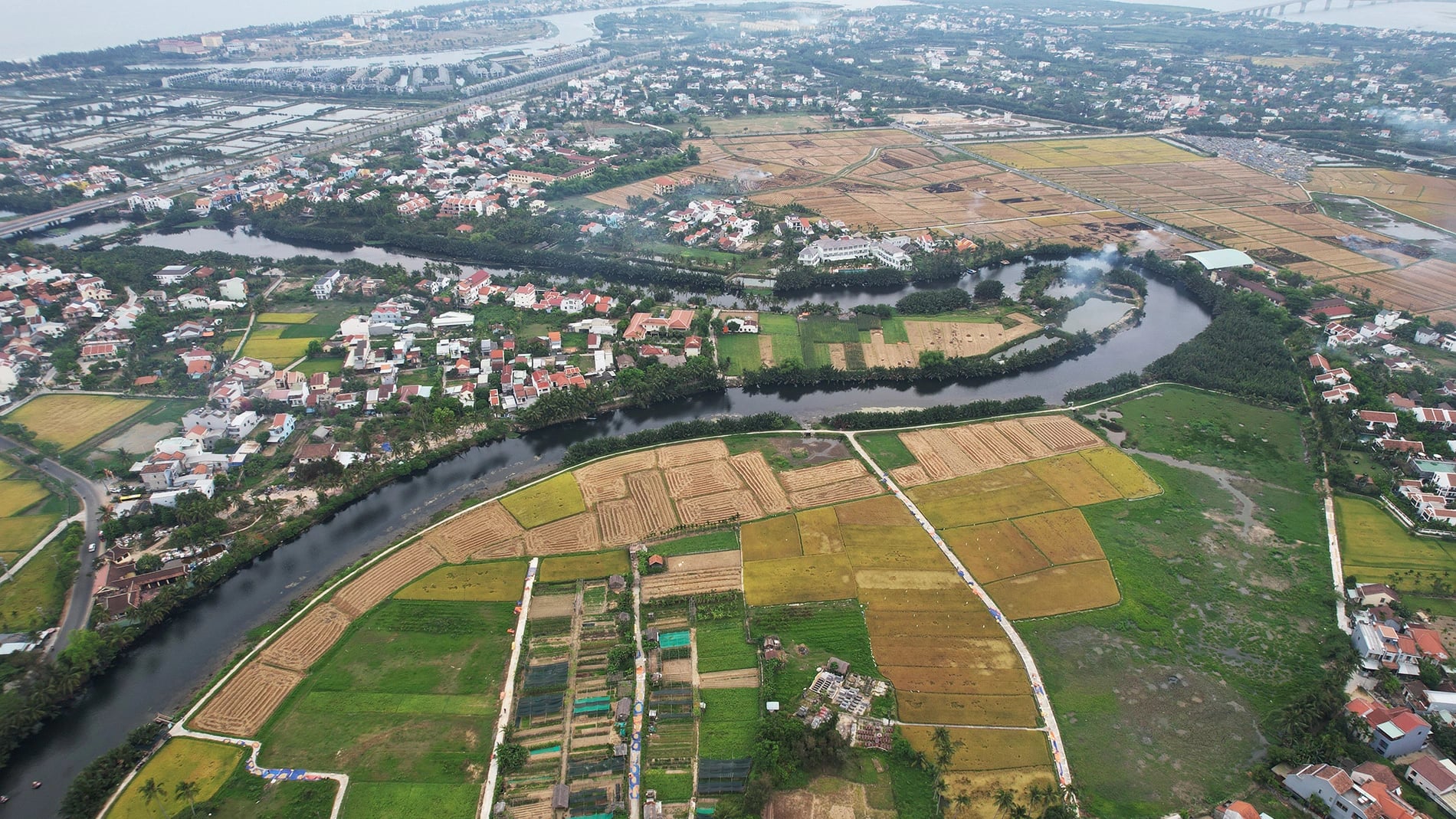 Paddy fields nestle next to a river on the edge of Hoi An Ancient Town, central Vietnam. Photo: Pham Van Son