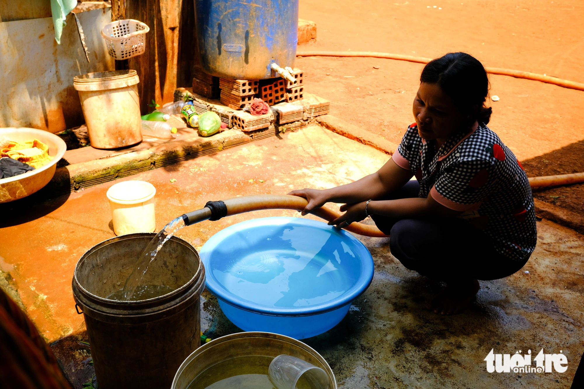 A woman pumps water for daily household needs in Ia Krieng Commune, Duc Co District, Gia Lai Province, Vietnam. Photo: Tan Luc / Tuoi Tre