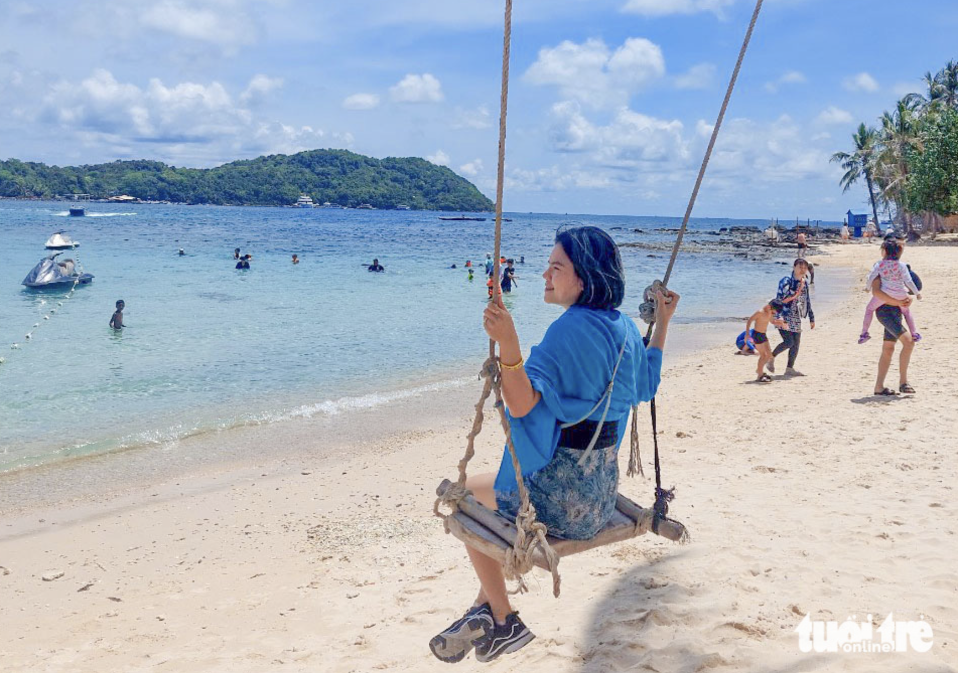 Lam Thi Chan, a tourist from Soc Trang Province, enjoys her Reunification Day (April 30) and International Workers' Day (May 1) holiday on Phu Quoc Island off Kien Giang Province, southwestern Vietnam. Photo: Chi Cong / Tuoi Tre