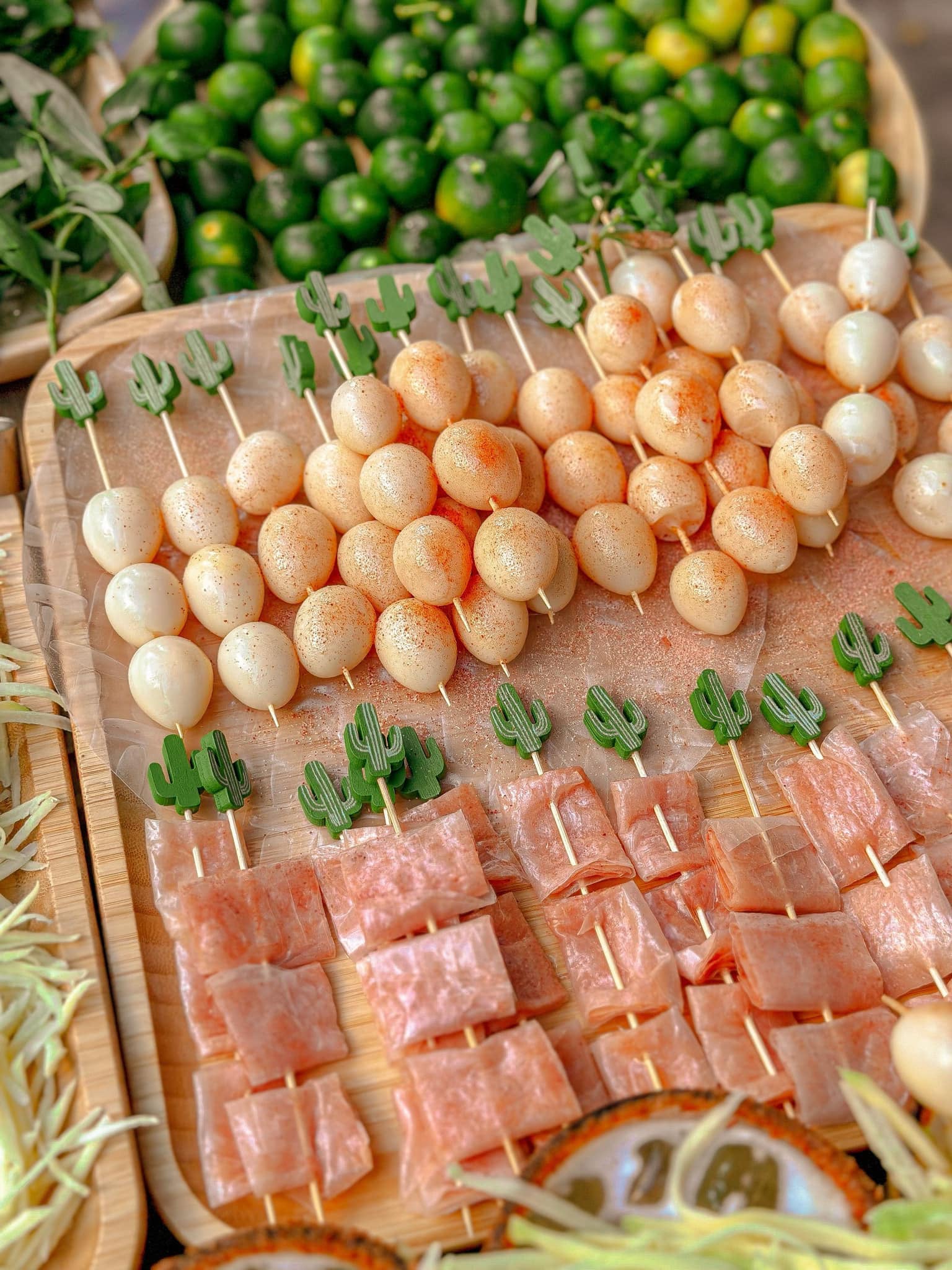 Rice paper and quail eggs are served in skewers as toppings for ‘trà bánh tráng trộn’. Photo: Triet Nguyen