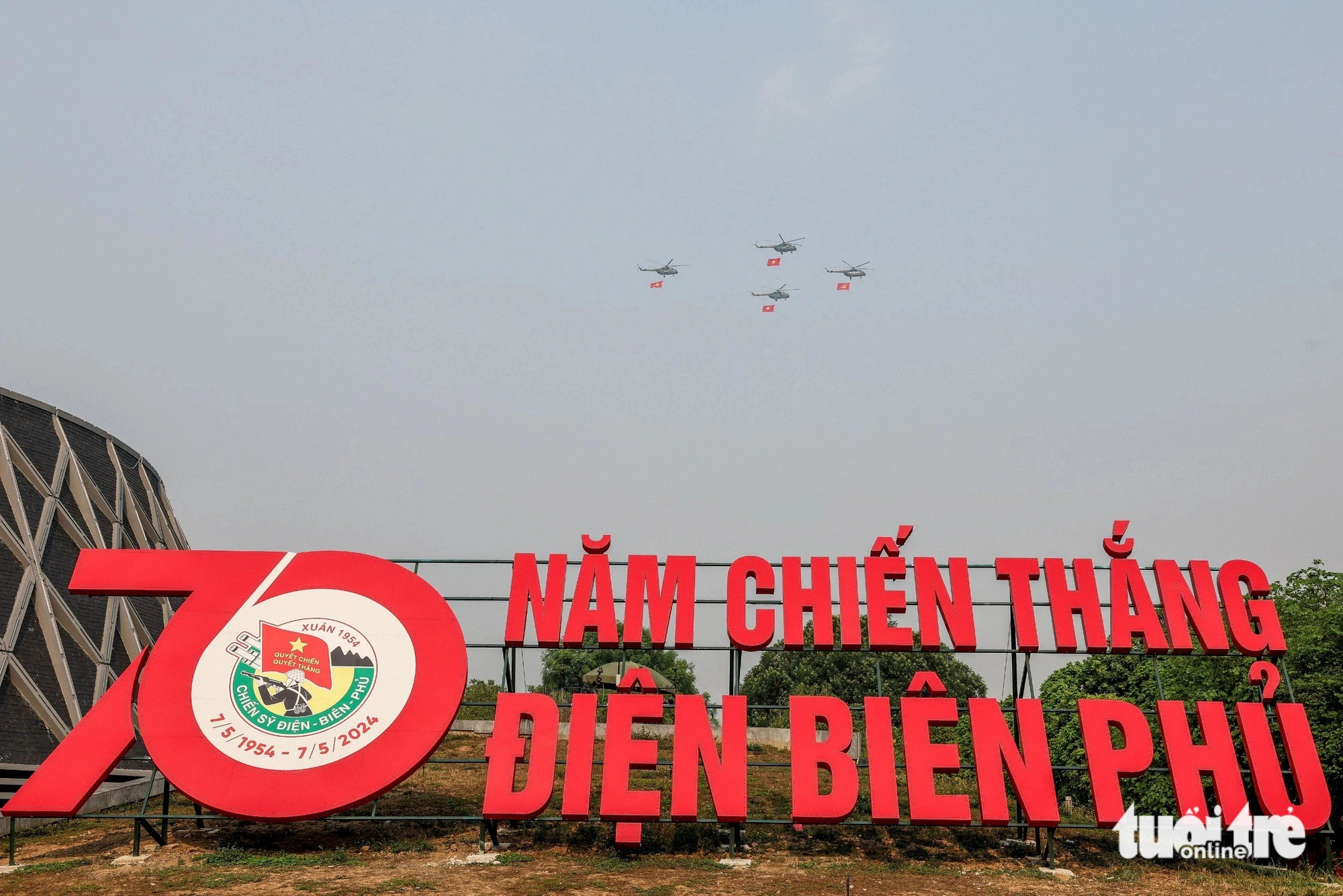 An armed helicopter squadron fly over the Dien Bien Phu Victory Museum in the rehearsal, Dien Bien Province, northwestern Vietnam, May 5, 2024. Photo: Nguyen Khanh / Tuoi Tre