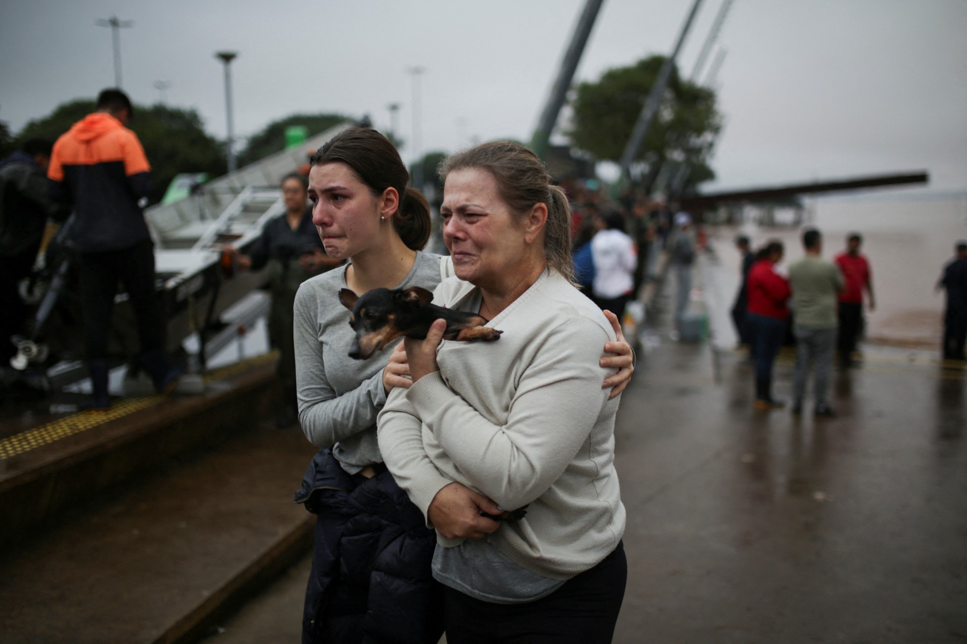 People react after being rescued from flood in Porto Alegre, in Rio Grande do Sul, Brazil, May 4, 2024. Photo: Reuters