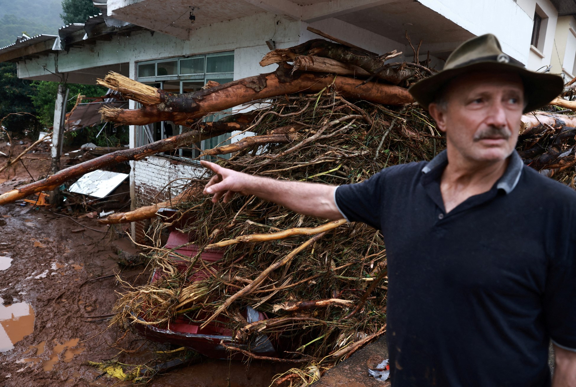 A man stands outside of a house affected by the floods at Relvado in Rio Grande do Sul, Brazil, May 3, 2024. Photo: Reuters