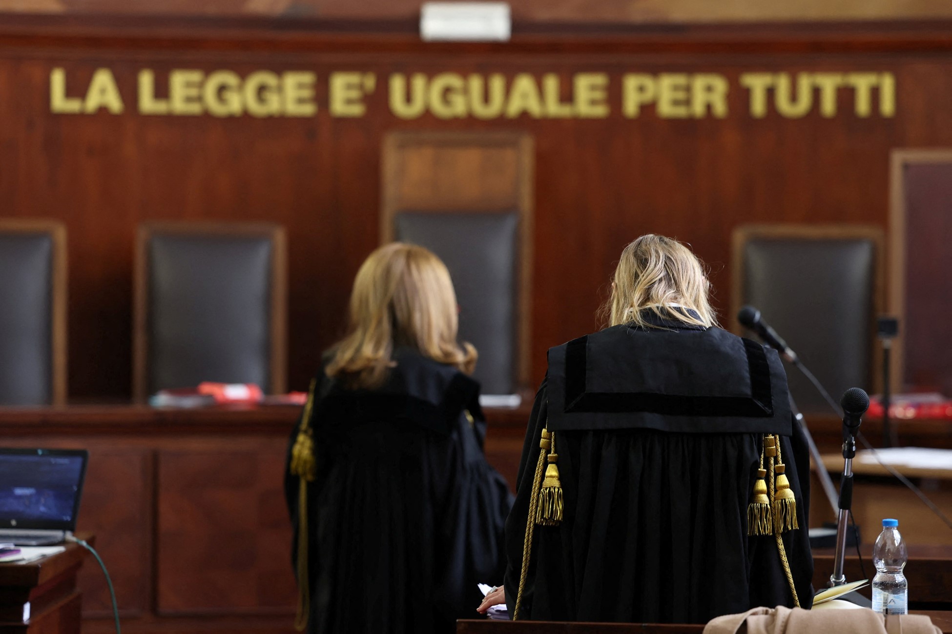 Two judges stand in a courtroom at Milan Court of Justice, in Milan, Italy, April 26, 2024. Photo: Reuters