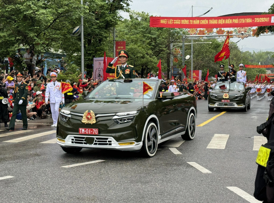 Military vehicles transporting high-ranking officers take part in a parade on a local street in Dien Bien Province, northwestern Vietnam to celebrate 70 years of the Dien Bien Phu victory on May 7, 2024. Photo: Nam Tran / Tuoi Tre