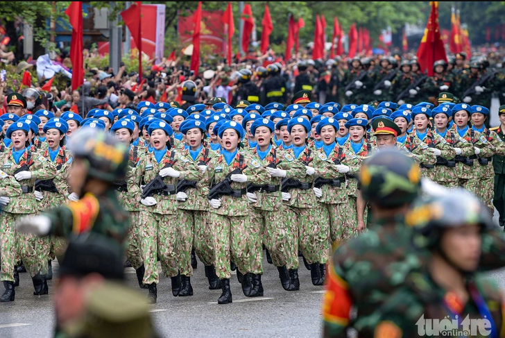 Female peacekeepers take part in a parade  on a local street to mark 70 years of the Dien Bien Phu victory in Dien Bien Province, May 7, 2024