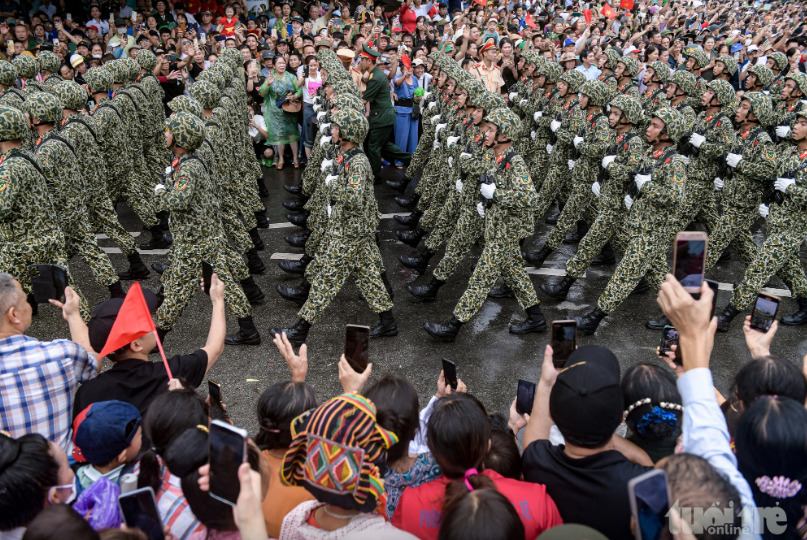 Maritime police officers parade in formation on a local street to mark 70 years of the Dien Bien Phu victory in Dien Bien Province, May 7, 2024