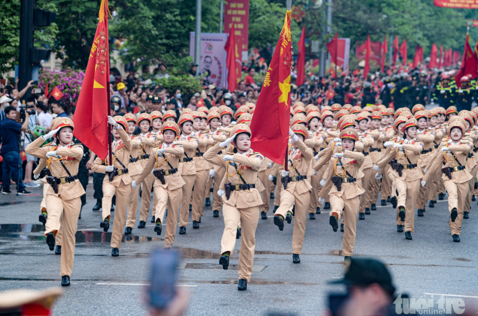 Female traffic police pfficers parade on a local street to mark 70 years of the Dien Bien Phu victory in Dien Bien Province, May 7, 2024