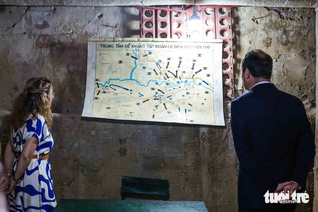 French Minister of Armed Forces Sébastien Lecornu and Patricia Miralles, Secretary of State to the Minister for the Armed Forces, look at a military map inside the bunker of late French General De Castries in Dien Bien Phu City, Bien Bien Province, northern Vietnam on May 6, 2024. Photo: Nguyen Khanh / Tuoi Tre