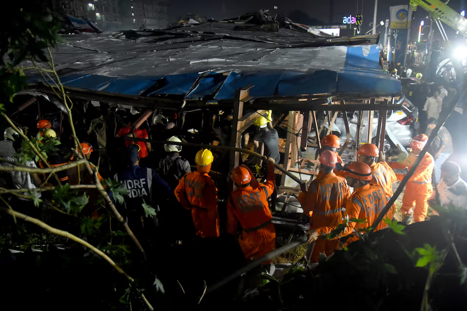 Members of rescue teams search for survivors amidst the debris after a massive billboard fell during a rainstorm in Mumbai, India, May 13, 2024. Photo: Reuters