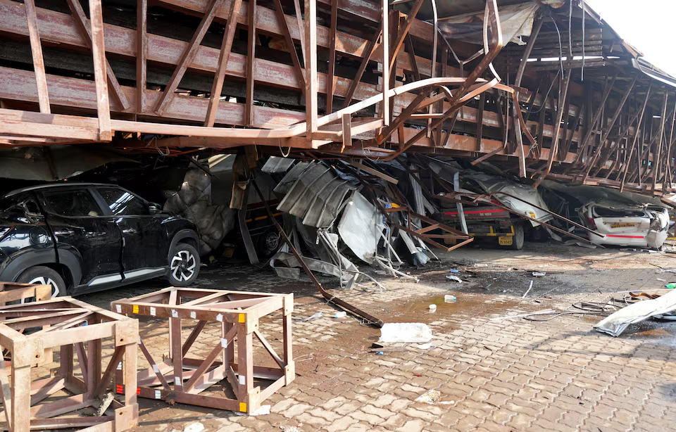 Vehicles are trapped under the debris after a massive billboard fell during a rainstorm in Mumbai, India, May 14, 2024. Photo: Reuters