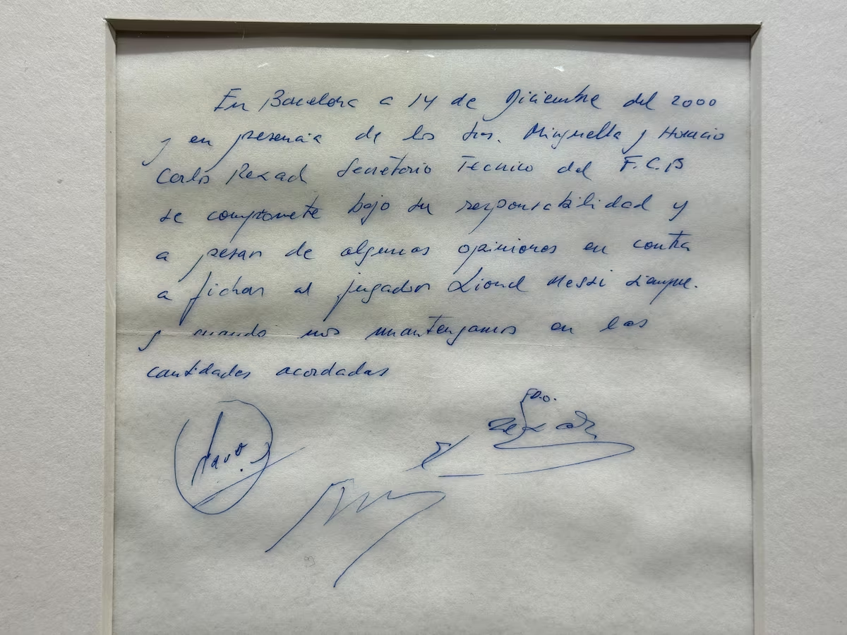 A signed and framed napkin on which soccer club Barcelona promised to sign a 13-year-old Lionel Messi is displayed at the Bonhams auction house in London, Britain May 8, 2024. Photo: Reuters