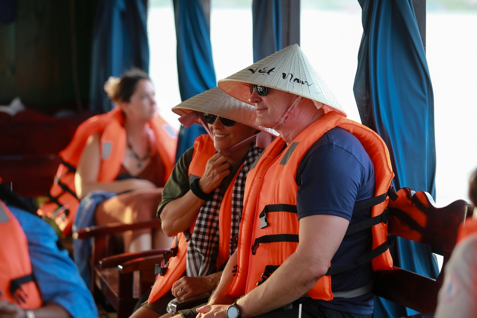 Foreign visitors admire the landscapes as they travel by boat to Thoi Son Isle, located on the Tien River in Tien Giang Province, southern Vietnam. Photo: Phuong Quyen / Tuoi Tre