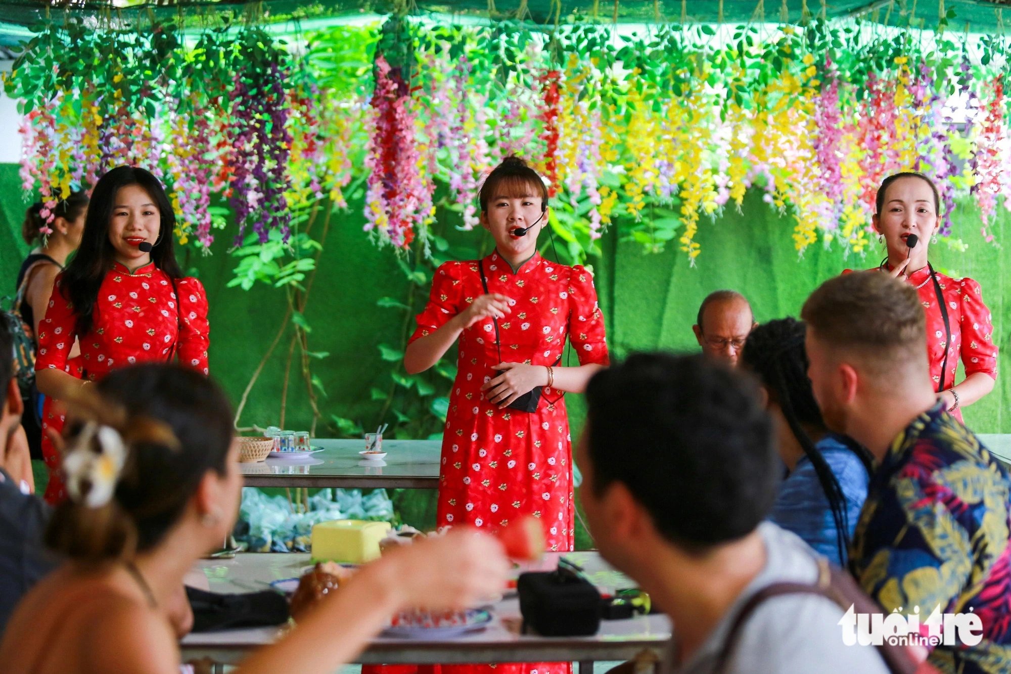 International visitors to Thoi Son Isle enjoy performances of Vietnam’s traditional music when they visit a fruit garden on the small island, on the Tien River in Tien Giang Province, southern Vietnam. Photo: Phuong Quyen / Tuoi Tre