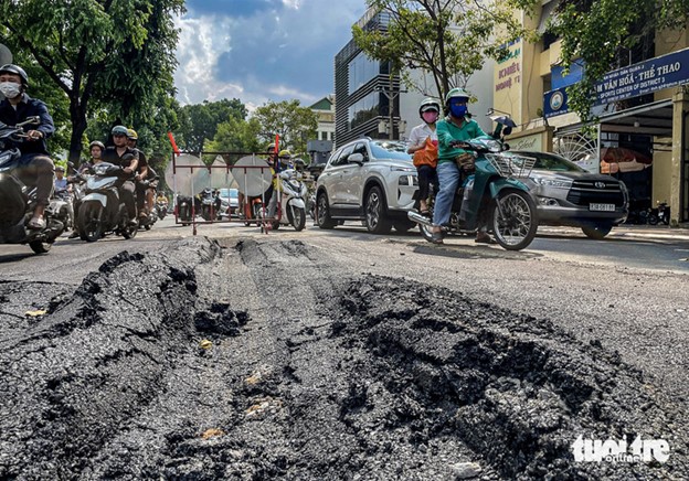Ho Chi Minh City street subsides, several hours after underground drainage system check
