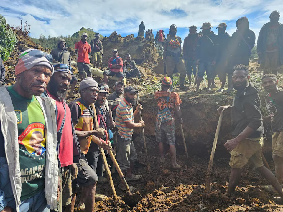 A locals gather amid the damage after a landslide in Maip Mulitaka, Enga province, Papua New Guinea May 24, 2024 in this obtained image. Photo: Reuters