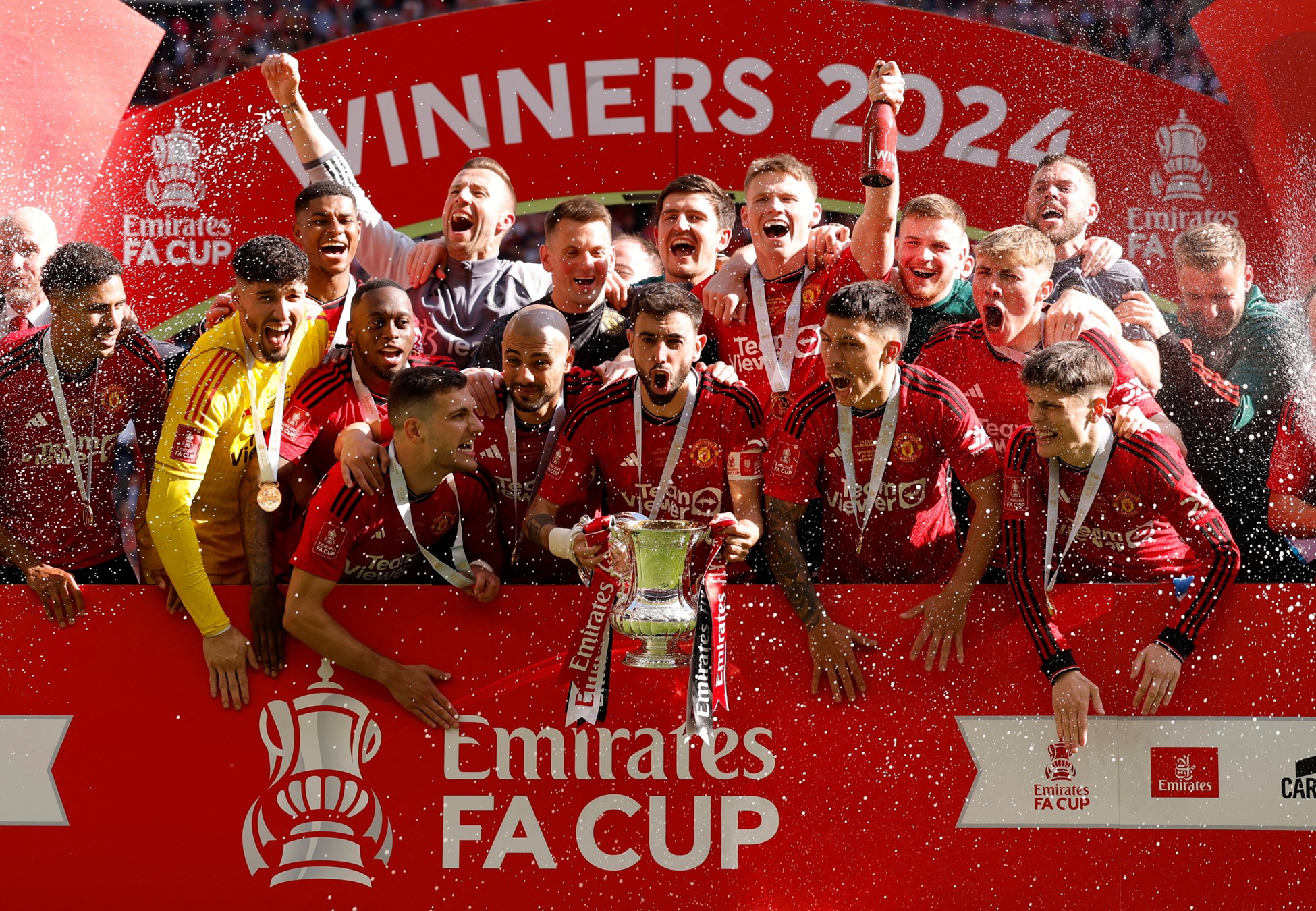 Soccer Football - FA Cup - Final - Manchester City v Manchester United - Wembley Stadium, London, Britain - May 25, 2024 Manchester United's Bruno Fernandes celebrates with the trophy and teammates after winning the FA Cup. Photo: Reuters