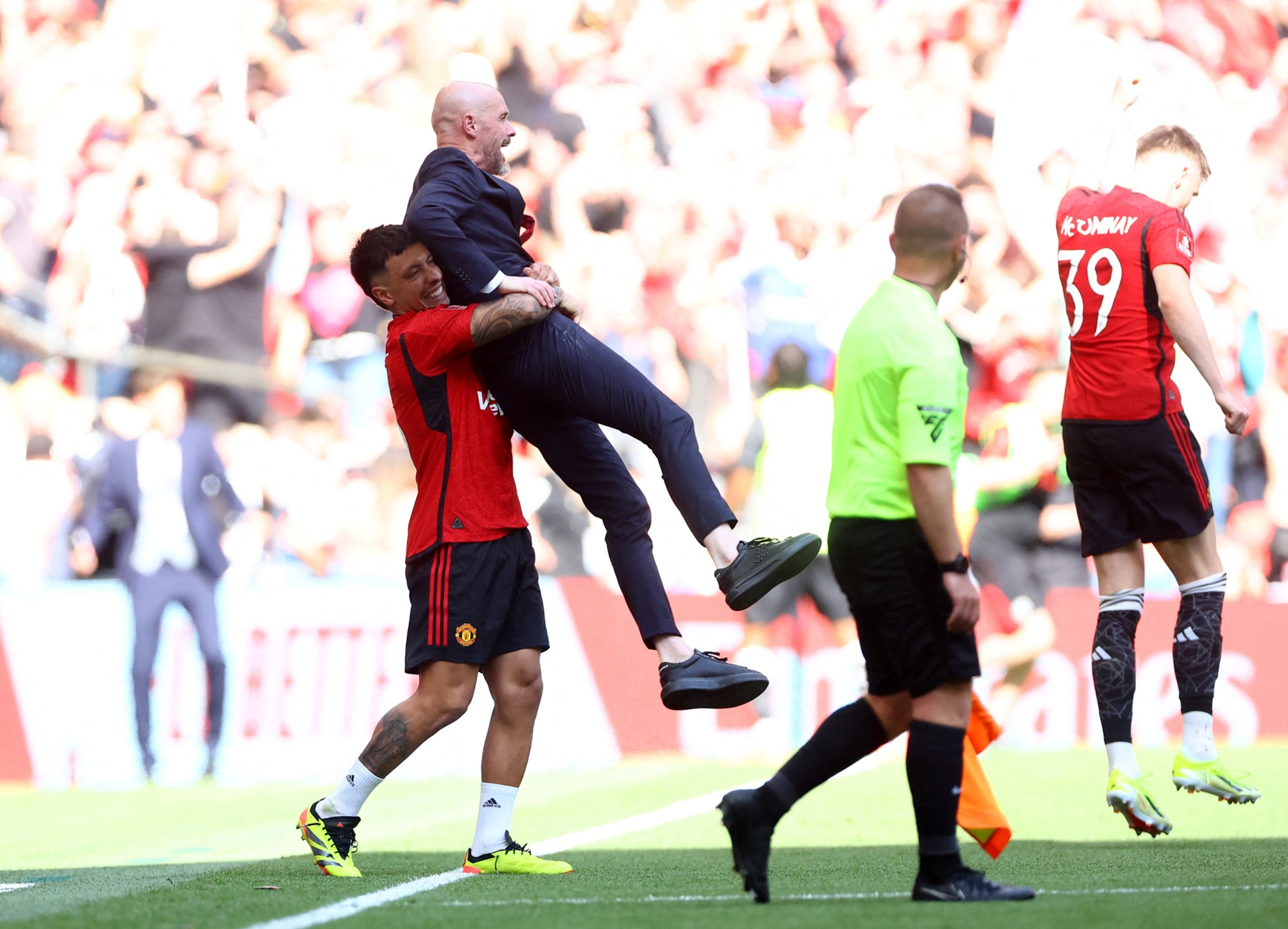 Soccer Football - FA Cup - Final - Manchester City v Manchester United - Wembley Stadium, London, Britain - May 25, 2024 Manchester United's Lisandro Martinez and manager Erik ten Hag celebrate after winning the FA Cup. Photo: Reuters
