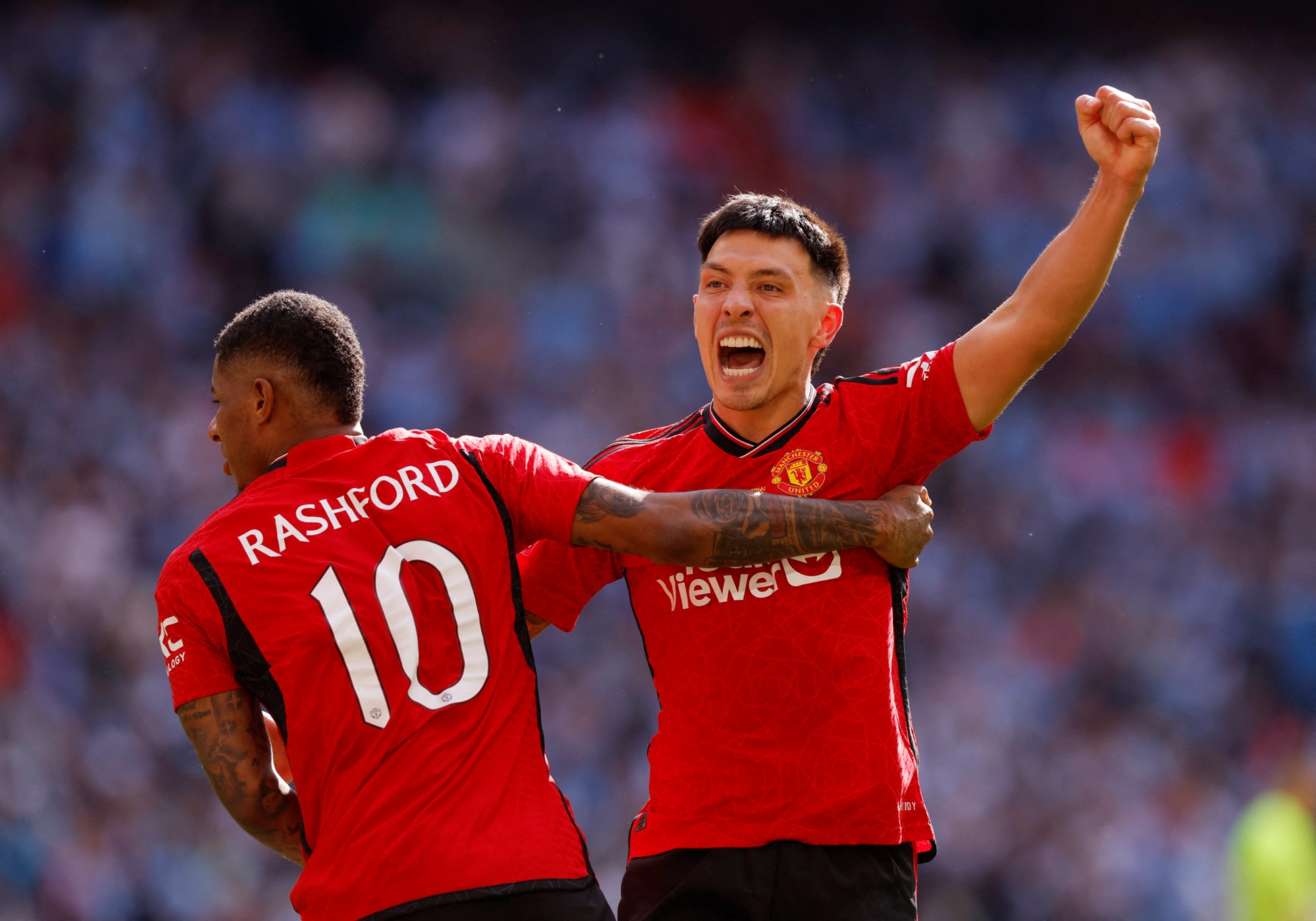 Soccer Football - FA Cup - Final - Manchester City v Manchester United - Wembley Stadium, London, Britain - May 25, 2024 Manchester United's Lisandro Martinez and Marcus Rashford celebrate after winning the FA Cup. Photo: Reuters