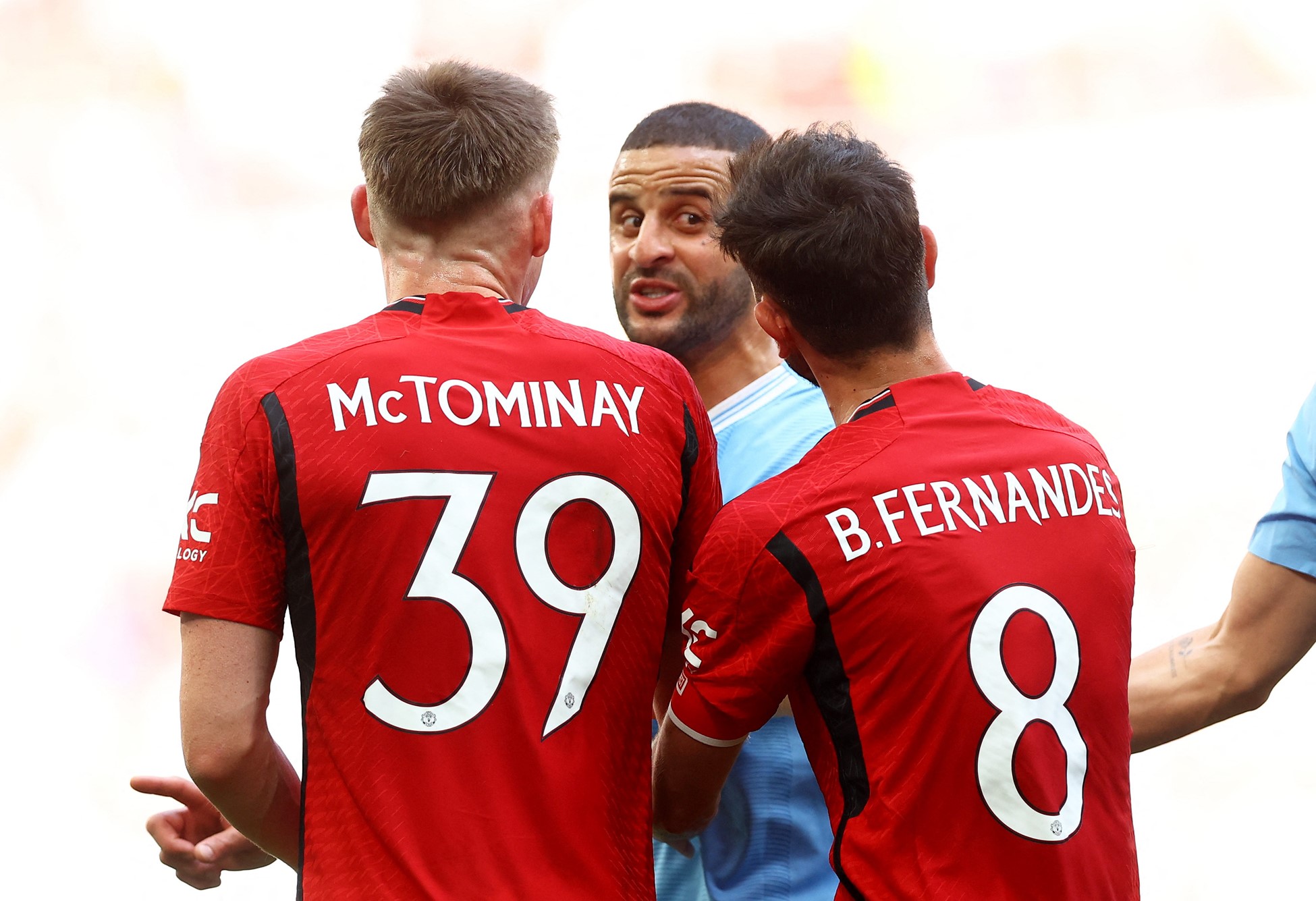 Soccer Football - FA Cup - Final - Manchester City v Manchester United - Wembley Stadium, London, Britain - May 25, 2024 Manchester City's Kyle Walker clashes with Manchester United's Scott McTominay and Bruno Fernandes. Photo: Reuters
