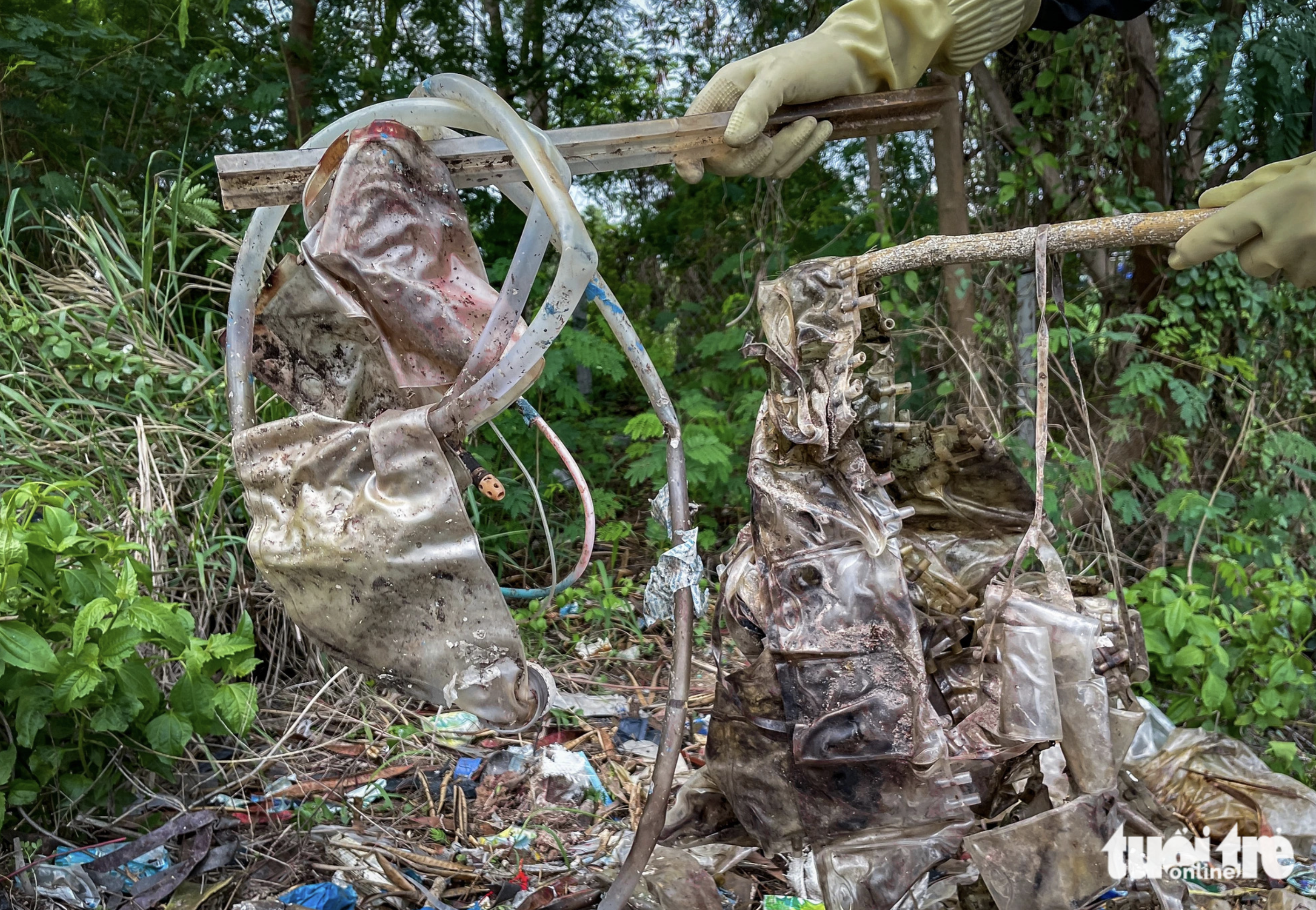 Area along swamp in Ho Chi Minh City covered with medical waste