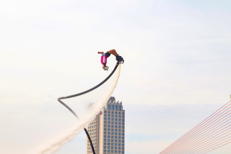 A flyboarder performs acrobatics.  Photo: Thanh Nguyen / Tuoi Tre