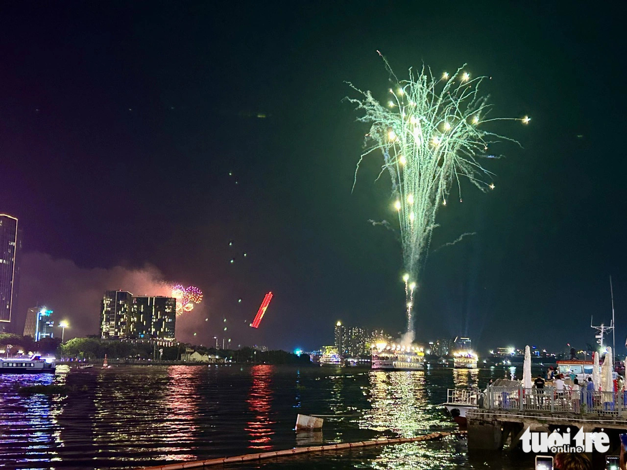 A view of the opening ceremony of the second Ho Chi Minh City River Festival held at Nha Rong-Khanh Hoi Wharf and Saigon Cruise Port from the other side of the Saigon River, May 31, 2024. Photo: T.T.D. / Tuoi Tre