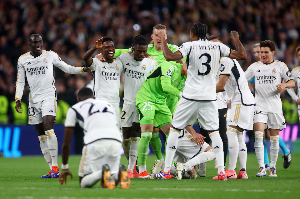 Soccer Football - Champions League - Final - Borussia Dortmund v Real Madrid - Wembley Stadium, London, Britain - June 1, 2024 Real Madrid's Vinicius Junior and teammates celebrate after winning the Champions League final. Photo: Reuters