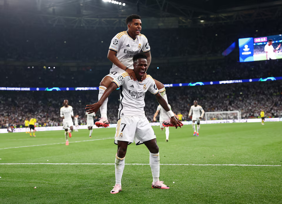 Soccer Football - Champions League - Final - Borussia Dortmund v Real Madrid - Wembley Stadium, London, Britain - June 1, 2024 Real Madrid's Vinicius Junior celebrates scoring their second goal with Rodrygo. Photo: Reuters