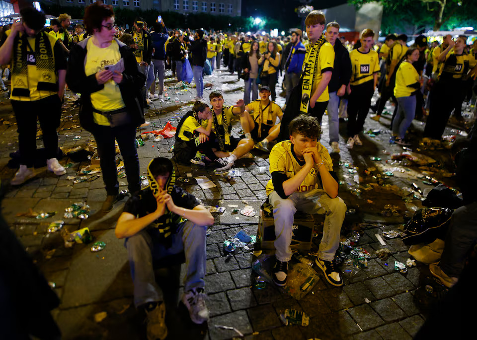 Soccer Football - Champions League - Final - Borussia Dortmund v Real Madrid - Fans gather in Dortmund - Dortmund, Germany - June 1, 2024 Borussia Dortmund fans react after watching the match at Hansaplatz. Photo: Reuters