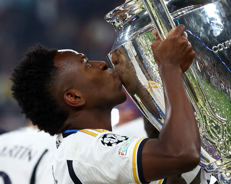 Soccer Football - Champions League - Final - Borussia Dortmund v Real Madrid - Wembley Stadium, London, Britain - June 1, 2024 Real Madrid's Vinicius Junior kisses the trophy as he celebrates after winning the Champions League. Photo: Reuters