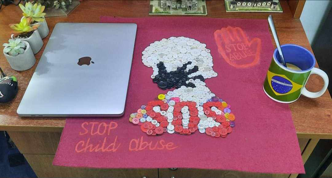 An artwork made by Nguyen Phuoc Quy Thanh using old shirt buttons advocates against child abuse.