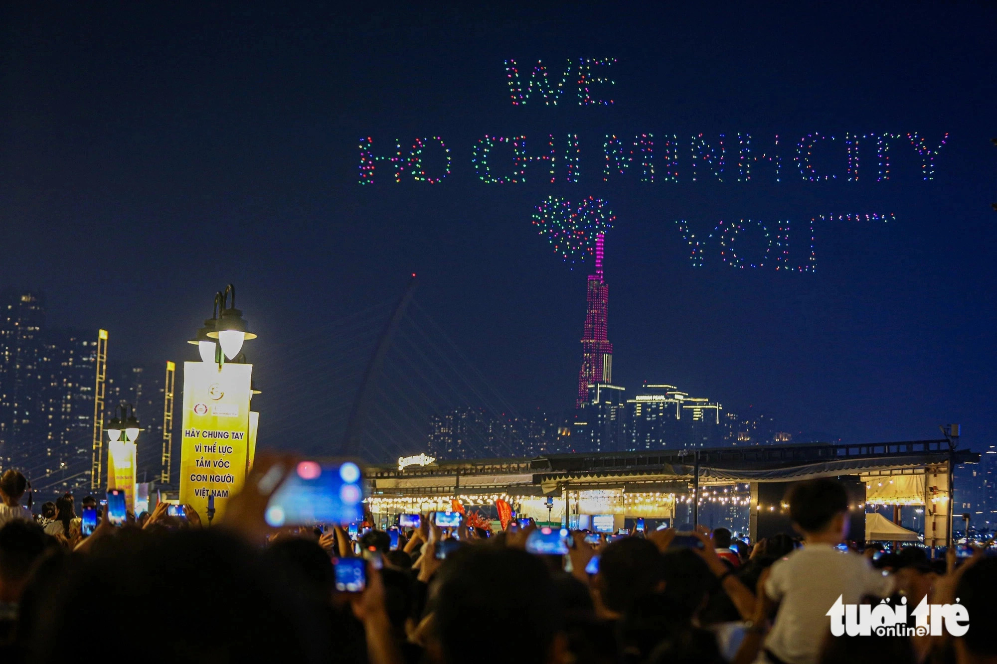 Drones illuminating the sky form the words ‘We Ho Chi Minh City ️ you’ during the conclusion of the second Ho Chi Minh City River Festival, June 9, 2024. Photo: Phuong Quyen / Tuoi Tre