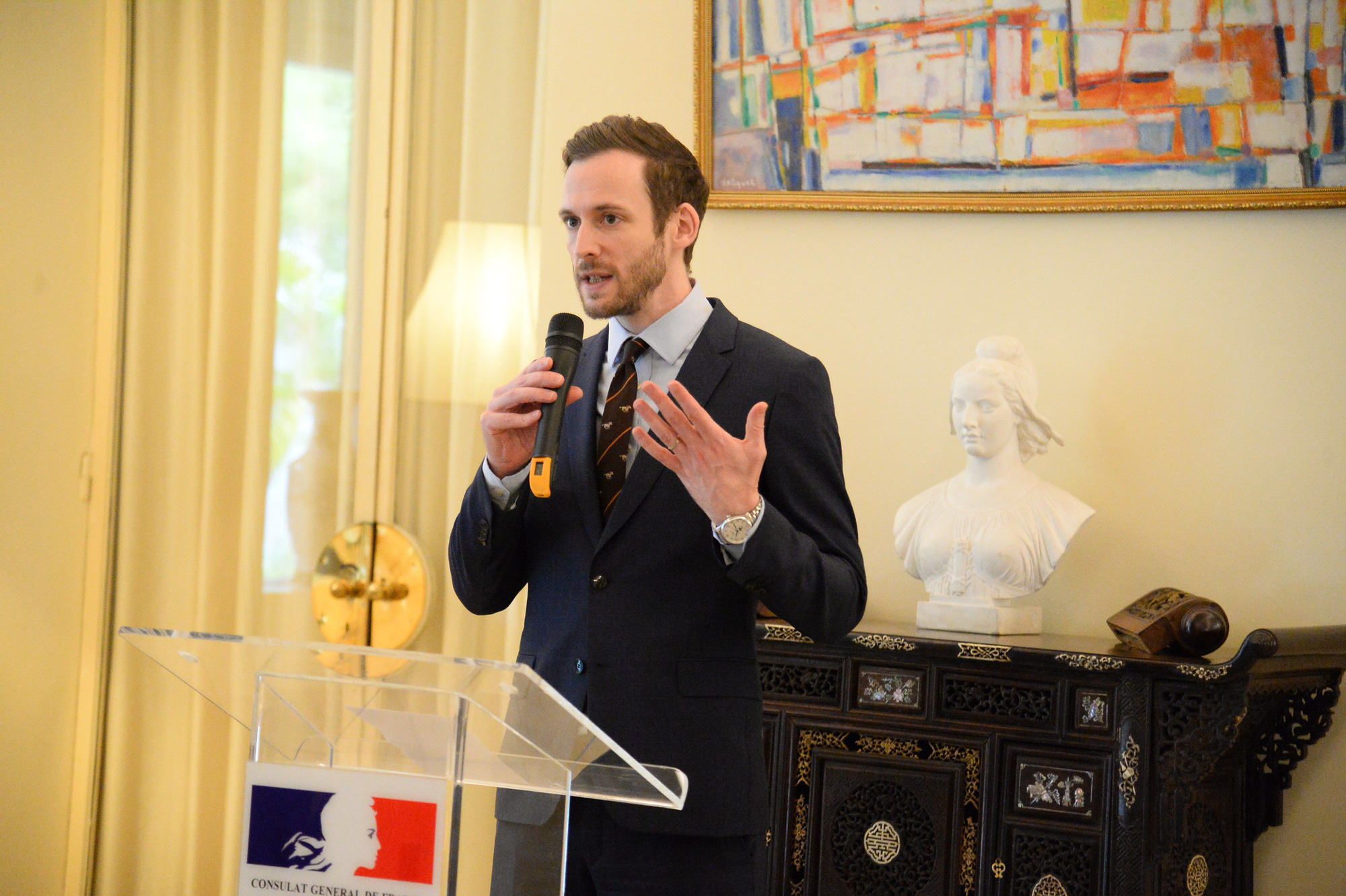 Deputy Consul General of France in Ho Chi Minh City, Grégory Robert, speaks at the opening ceremony for the ‘Sports and Fraternity’ exhibition at the French Residence on Le Duan Street in District 1, Ho Chi Minh City, June 11, 2024. Photo: Hai Quynh / Tuoi Tre