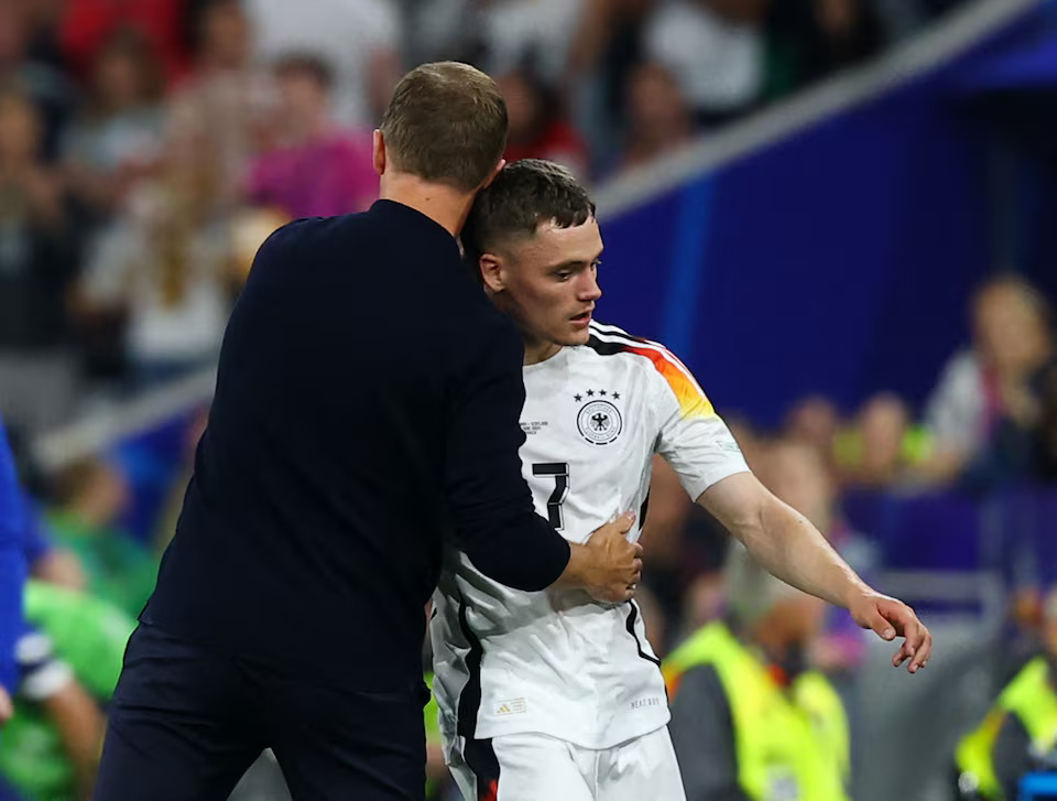 Soccer Football - Euro 2024 - Group A - Germany v Scotland - Munich Football Arena, Munich, Germany - June 14, 2024 Germany's Florian Wirtz with coach Julian Nagelsmann after being substituted. Photo: Reuters