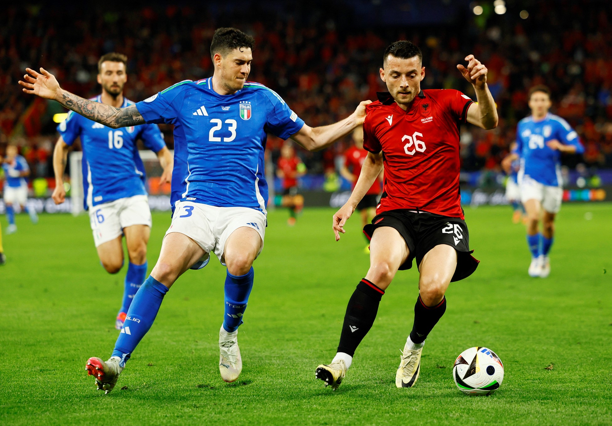 Soccer Football - Euro 2024 - Group B - Italy v Albania - Dortmund BVB Stadion, Dortmund, Germany - June 15, 2024 Italy's Alessandro Bastoni in action with Albania's Arber Hoxha. Photo: Reuters